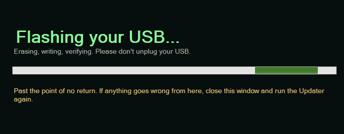 PortableMind Updater flashing screen reading erasing, writing, verifying, with the past-the-point-of-no-return notice